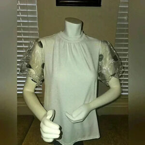 Luxology size M White blouse sheer puff sleeves with polka dots.